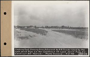 Contract No. 85, Manufacture and Delivery of Precast Concrete Steel Cylinder Pipe, Southborough, Framingham, Wayland, Natick, Weston, looking east showing area adjacent to railroad tracks used by the Lock Joint Pipe Co., Natick, Mass., Sep. 5, 1940