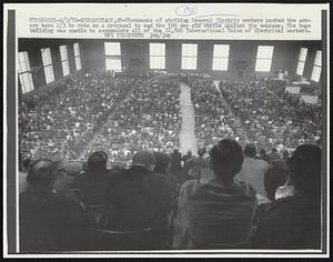 Schenectady, NY -- Thousands of striking General Electric workers packed the armory here 2/3 to vote on a proposal to end the 100 day old strike against the company. The huge building was unable to accommodate all of the 12,500 International Union of Electrical workers.
