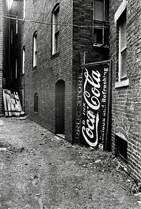 Coca Cola sign in alley