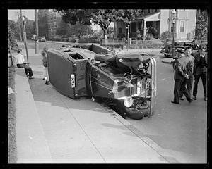 Overturned taxi on its side