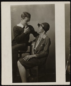 Young man with pipe, young woman with hat