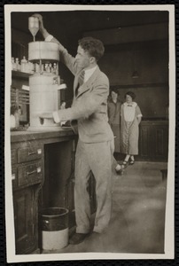 Young man by chemistry equipment