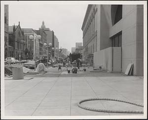 Construction of Boylston Building, Boston Public Library, laying brick outside Boylston Street entrance