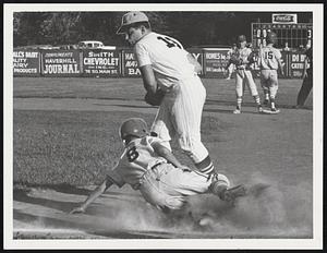 Medford vs. Lawrence east @Haverhill. 4th inning Billy Jensen (Medford) is out on a close play at 1st Base. Ball is taken by Lawrence Baseman Glenn McCann.