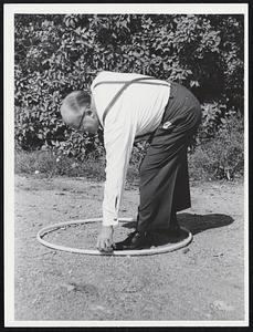 Don Carr, manager, F.W. Woolworth, Wollaston Branch, President Wollaston Businessmens’ Association, with hula hoop