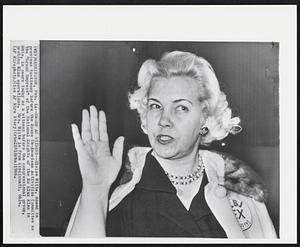 Sworn as Witness--Eloise Witte, named in previous testimony before the House Un-American Activities Committee as the "Grand Empress" of the National Knights of the Ku KIux Klan in Ohio, is sworn today as a witness before the congressional group, probing Klan operations. Mrs. Witte is from Cincinnati, Ohio.