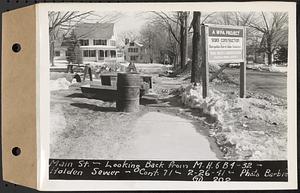 Contract No. 71, WPA Sewer Construction, Holden, Main Street, looking back from manhole 6B4-32, Holden Sewer, Holden, Mass., Feb. 26, 1941