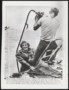 Sets Women's Deep Sea Diving Record--Mrs. Norma Hanson, 26-year-old mother, prepares to make her record breaking dive of 226 feet to the ocean floor here yesterday. Her descent bettered by 68 feet the unofficial mark set two weeks ago by Jerry Lee Cross off Los Angeles harbor. Spud Murphy assists her.