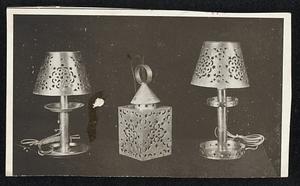 Pierced tin, brass copper and pewter provide chaming lighting effects in these lamps wired for electricity.