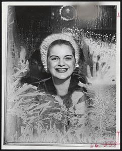 Warm Smile For A Frosty Outlook -- Roxanne O'Dwyer of Boston looks through a frosty window pane and decides she'll stay inside. No wonder, today was the coldest day in two years in Boston.