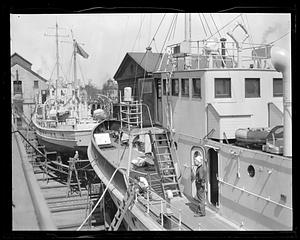 US Coast Guard ships in dry dock, possibly the "Harriet Lane" and "Jackson"