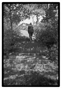 A man walking up stairs