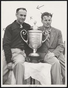 Pinehurst, N.C.--Denny Shute (left), of the Brae Burn Country Club, West Newton, Mass., and Jimmie Thomson of the Shawnee Country Club, Shawnee-on-Delaware, Pa., shown with the trophy for which they matched strokes in the thirty-six-hole final round of the Professional Golfers Association championship play on the links of the Pinehurst Country Club here Nov. 22. To reach the top rung in the tournament, Shute defeated Wild Bill Melhorn, unattached, of Louisville, Ky., while Thomson eliminated Craig Wood of the Hollywood Golf Club, Deal, N.J., in the semi-finals.