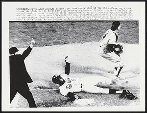 Dodger John Roseboro, giving it the old college try, slides across the plate but is forced by John Kennedy's grounder to Mets shortstop Roy McMillan who optioned to throw to catcher Chris Cannizzaro, cutting off the run with the bases loaded in the 7th inning here 6/22. Umpire is Bill Jackowski. Cannizzaro is looking, but cannot make another play. The next batter up, pinch hitter Lou Johnson, sacrificed in a run to break a 2-2 standoff as the Dodgers rolled past the Mets 4-2.
