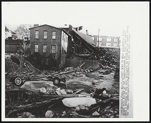 Three Dead in Mill Collapse-- Three people were killed at the Turner-Stanton Co., here last night when a section of the mill collapsed as flood-waters raced through the town.