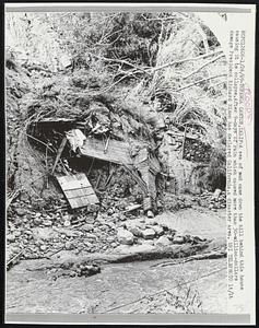 A sea of mud came down the hill behind this house causing it to collapse. After 9-days of rain which caused more than 30-million-dollars damage President Richard Nixon has declared California, a disaster area.