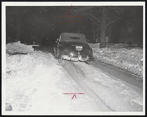 Boston and Milton Streets Week After Storm-Above, thickly-populated Queensberry street, one of the Back Bay's busiest thoroughfares. The street is one-lane and thickly rutted. Below, Blue Hill parkway at Brook road, Milton, one of photos ordered taken by Mayor Curley to "prove" that suburbs have done more poorly than Boston in snow removal.