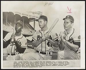 Ready for the Yankees--Trio of heavy hitting Milwaukee Braves pose before taking workout at Stadium this afternoon on eve of opening game of the World Series against New York Yankees. Left to right: Outfielder Henry Aaron, Third Baseman Eddie Mathews and First Baseman Joe Adcock.