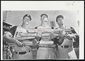 Three Members of the Pittsburgh power department carry their artillery into Forbes Field today for the start of the World Series. Left to right are third baseban Don Hoak, first baseman Dick Stuart and shortstop Dick Groat.
