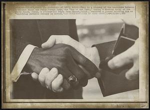 Handshake at White House -- This is a closeup of the handshake between President Nixon and Perry Joseph Ludy, the "Boy of the Year," during a meeting today at the White House. Perry, a 17-year-old Negro from Oxnard, Calif., received a plaque saluting him as "typifying juvenile decency in action.