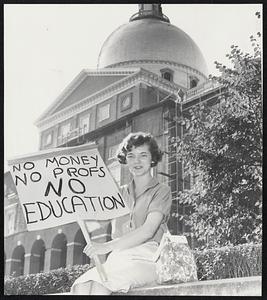 Protest against veto of bill to increase pay of teachers at State schools by Mrs. Margaret Roussieu, wife of U Mass grad student