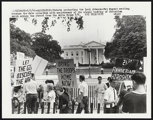 Pickets protesting the Luci Johnson-Pat Nugent wedding because the date coincided with anniversary of the atomic bombing of Hiroshima march across the street from the White House 8/6.