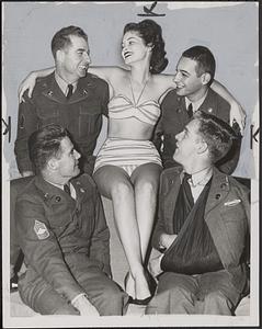 June Tolley, 20, with soldiers in New York