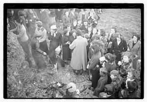 A group of young women cooking food on a fire