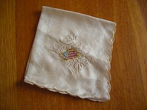 White embroidered handkerchief, with scalloped edge