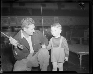 Ted Williams gives fishing lesson to little boy