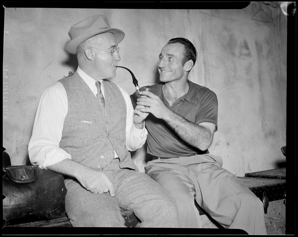 Man gets help with smoking his pipe