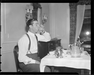 Joe DiMaggio having his room service breakfast in hotel room