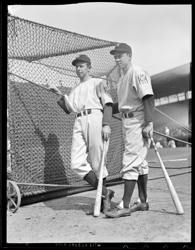 Washington Senators players wait their turn in the batting cage