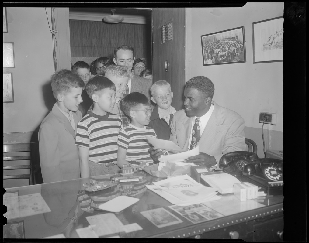 Jackie Robinson of the Brooklyn Dodgers signs autographs for kids at Braves  Field - Digital Commonwealth
