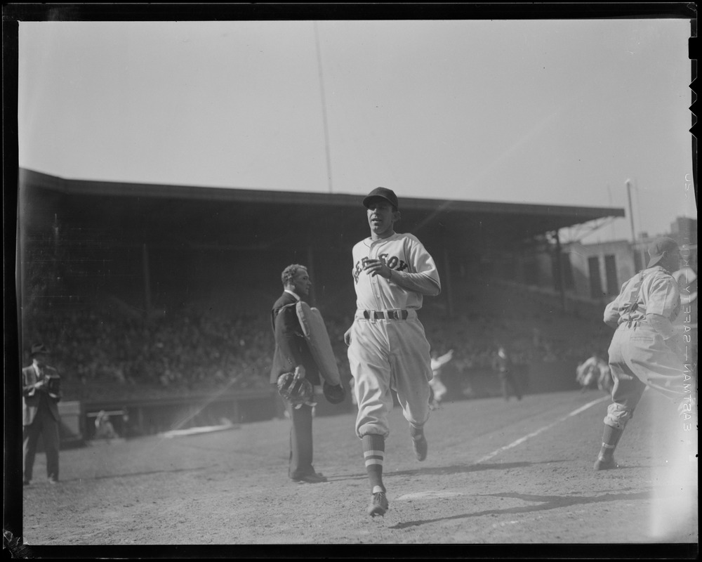 Red Sox player crosses the plate