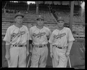 Jackie Robinson of the Brooklyn Dodgers signs autographs for kids at Braves  Field - Digital Commonwealth