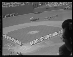 Yankees and Red Sox lined up on field for the raising of the flag, at Fenway