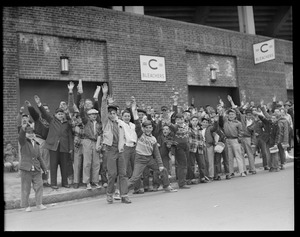 Kids crowding outside the bleachers entrance on Opening Day at Fenway