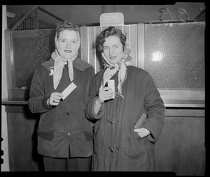 Women holding Red Sox tickets
