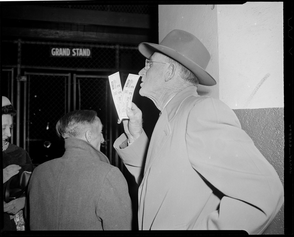 Man holds tickets for Game 2 of the World Series between the Braves and Indians