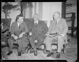 Three men seated: owners?