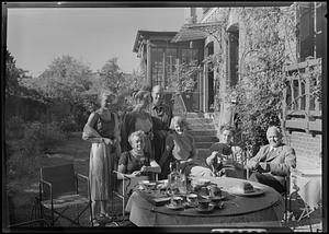 Group having tea in garden