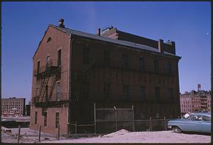 Three-story red brick building