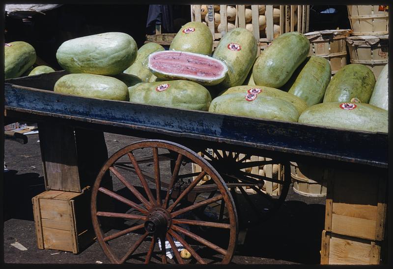 Watermelons for sale on cart