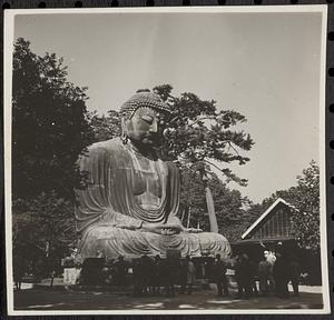 Crowd around a large Buddha