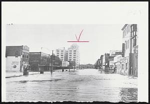 Floods hit Galveston, Tex., as result of high tides caused by Hurricane Carla. Rain and strong winds also accompanied disturbance.