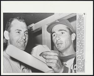 I Smacked It Here--Ace pitcher Sandy Koufax, right,indicates with finger,just about where he caught the home-run-ball on his bat that beat the Milwaukee Braves,2-1,last night.Dodger teammate Daryl Spencer,left,drove in the first run.Koufax allowed just three hits, beating veteran Warren Spahn.Scene is in the dressing room.