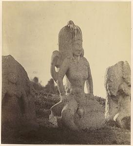 View of sculpture of deity, possibly at Mamallapuram, India