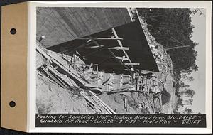 Contract No. 82, Constructing Quabbin Hill Road, Ware, footing for retaining wall, looking ahead from Sta. 24+25, Ware, Mass., Sep. 7, 1939