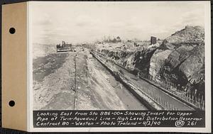 Contract No. 80, High Level Distribution Reservoir, Weston, looking east from Sta. 886+00+/- showing invert for upper pipe of twin aqueduct line, high level distribution reservoir, Weston, Mass., Apr. 2, 1940